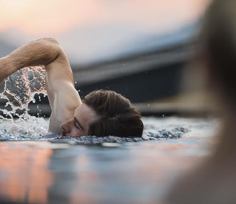 Man swims in the sky pool