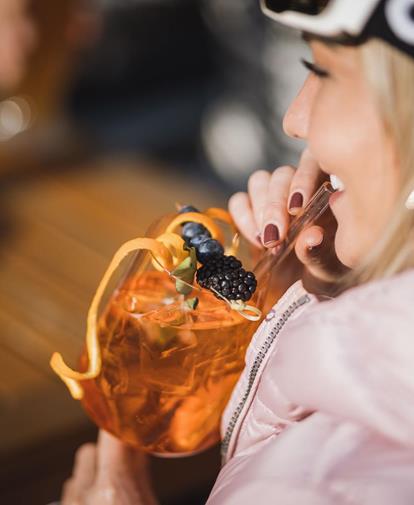 Woman having an aperitif